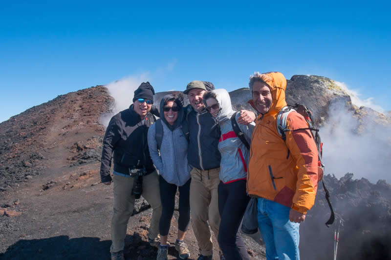 A happy american clients group during the Etna summit craters tour