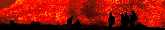 Etna excursions tour - trekkers close by an active  lava flow during an Etna eruption tour